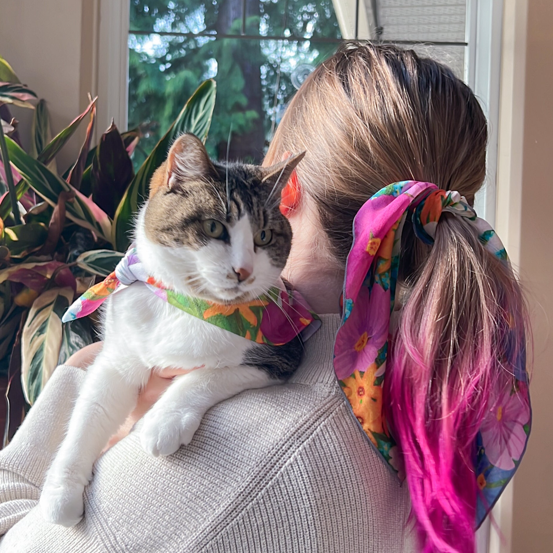 Woman and cat in matching silk scarf and pet bandana set